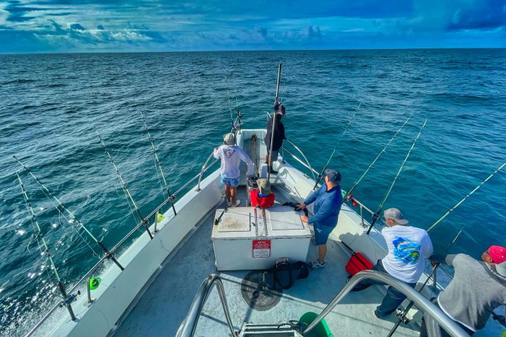 a group of people on a boat in the water
